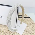 Detailed macro view of sparkling rhinestone and pearl headband with non-slip beige lining - Diamond Lattice White Stone