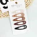 Close-up of five milk tea brown star and teardrop hair clips on white card packaging - Gradient Milk Tea Water Drop Style (NM-6621)