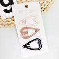Three-piece heart shaped metal hair clips in beige, light brown, and black colors - Milk Tea Series Heart Shape (HM-8521)