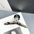 Detailansicht der Luxus Haarklammer mit bunten Kristallen und funkelnden Strasssteinen - Kleiderbügel-Stil Kristall Strass Kralle