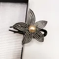 Elegant flower hair claw clip with rhinestones and faux pearl on a minimalist white background - Champagne Rhinestone
