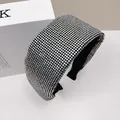 Padded wide headband featuring high-density silver rhinestones on black fabric base - White Zircon