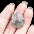 Polished teardrop labradorite stone pendant with natural black mineral inclusions - Labradorite