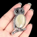 Antique silver owl necklace pendant featuring a polished yellow natural stone inlay - White Shell