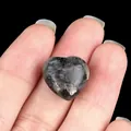 Natural heart-shaped black stone ornament with authentic raw mineral textures - Larvikite