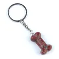 Portachiavi in diaspro rosso a forma di osso con anello in metallo argentato - Pietra di Sesamo