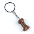 Porte-clés en agate naturelle poli en forme d'os avec des textures minérales rouges - Agate d'Inde