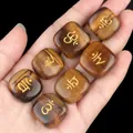 Lot de sept pierres de yoga Oeil de Tigre avec symboles de chakra dorés - Oeil de Tigre (Ensemble)