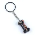 Porte-clés cristal rhodonite naturel en forme d'os avec anneau en métal argenté - Rhodonite
