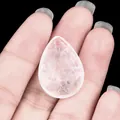 Handheld translucent teardrop rose quartz crystal pendant with natural ice crack texture - White Crystal