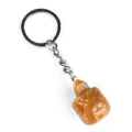 Yellow crystal turtle keychain with engraved tortoiseshell texture and silver metal ring - Topaz
