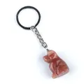 Handcarved puppy keychain made of natural reddish gemstone with polished metal ring - Purple Aventurine
