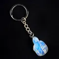 Turtle keychain pendant made of opalite crystal with blue iridescent finish and silver chain - Opal (Synthetic)