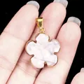 Howlite five-petal flower pendant with gold plated rim and marbled texture - Howlite