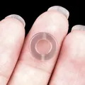Pink agate donut charm held on fingertip showing translucent texture and 15mm size - 10mm / Grey Agate