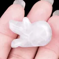 Carved white crystal pig gemstone ornament figurine displayed on a hand - White Crystal