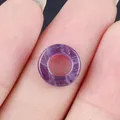 Flat round purple amethyst stone bead held in hand for DIY necklace and jewelry making - 10mm / Amethyst