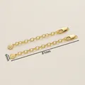 Detailed view of 18K gold-plated extender chain with lobster clasp and round tag - 6x81mm