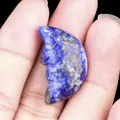 Lapis lazuli moon stone carved with a face profile featuring deep blue and gold spots - Lapis Lazuli