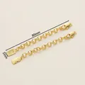 Detail of 18K gold-plated necklace extender chain with lobster clasp and coin tag - 5x80mm