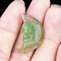 Hand carved natural green fluorite moon face stone pendant with detailed profile - Fluorite