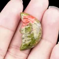 Handheld carved Unakite moon face stone pendant with polished green and pink texture - Unakite