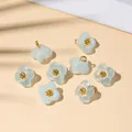 Set of eight light blue glass flower pendants with gold core for DIY jewelry making - 10x10mm / Blue