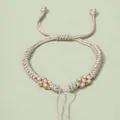 Handgefertigtes geflochtenes Pfirsichblüten-Armband in Beige mit verstellbarem Zugverschluss - Champagner