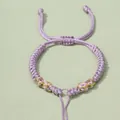 Handgefertigtes lila Kordelarmband mit verstellbarem Knoten und Goldakzenten - Helllila