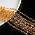 Faceted amber champagne glass beads in elongated bicone shape for DIY jewelry making - Large / Transparent Light Brown