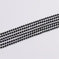 Detailed macro view of five parallel black metal ball chains for DIY jewelry making projects - Black