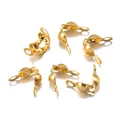 Macro view of six gold-plated double bead necklace clasp findings on white background - 4x7mm / Gold