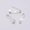 Macro view of silver iron safety pins with dual holes for DIY jewelry making - 15mm / Silver