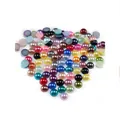 Close-up of colorful flatback ABS pearl beads for nail art and DIY jewelry crafts - Multicolor