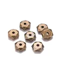 Detailed macro view of 7mm antique bronze faceted hexagon spacer beads for DIY jewelry - 7mm (Hole 1.2mm, 200 Pcs/Pack) / Antique Bronze