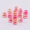 Macro detail of gradient pink ABS imitation pearl beads with holes for DIY jewelry making - Peach Pink