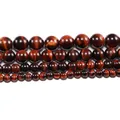 Detailed view of polished natural red tiger eye beads in multiple sizes for DIY jewelry - US 4 / Red Tiger Eye