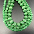 Vibrant green cat eye stone round beads for DIY bracelet making showing cat eye effect - Green