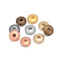 Macro view of 8mm metallic disc spacer beads in gold silver and bronze for DIY jewelry - Multicolor