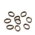 Macro shot of bronze oval open jump rings for DIY jewelry necklaces and bracelets - 4*3mm (300 Pcs/Pack) / Bronze