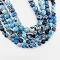 Polished round natural fire agate beads in marbled blue and white pattern - Light Blue