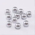 Close-up of high-gloss silver ABS imitation pearls with smooth metallic finish for DIY jewelry - 10mm (500g/Pack) / Light Gray