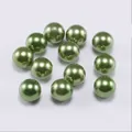 Close-up of bright grass green round imitation pearls with glossy pearlescent finish - 10mm (500g/Pack) / Green