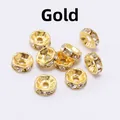 Detailed view of ten gold-colored spacers with white rhinestones on a white background - 8mm (2000 Pieces/Pack) / Gold