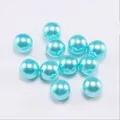Macro detail of sky blue round faux pearls with soft pearlescent luster for DIY jewelry - Sky Blue