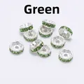 Macro shot of silver alloy rondelle spacer beads with sparkling green crystal rhinestones - 8mm (2000 Pieces/Pack) / Green Zirconia