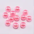 Macro detail of glossy pink round faux pearl beads for DIY jewelry making and crafts - Pink
