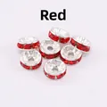 Macro detail of seven silver metal spacer beads with red rhinestones for jewelry making - 8mm (2000 Pieces/Pack) / Red Rhinestone