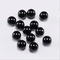 Close-up of polished black round acrylic spacer beads for DIY jewelry making - Black