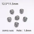 Macro detail of antique silver lion head alloy beads showing size 12.5x11.5mm and 1.8mm hole - 300PCS/Pack / Silver Lion Head
